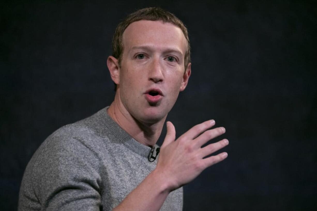 FILE - This Jan. 17, 2017, file photo shows a Facebook logo being displayed in a start-up companies gathering at Paris&#039; Station F, in Paris. Facebook CEO Mark Zuckerberg plans to speak on Friday, Oct. 25, 2019, with new Corp CEO Robert Thomson.