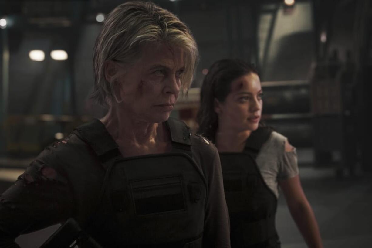 This image released by Paramount Pictures shows Linda Hamilton, left, and Natalia Reyes in &quot;Terminator: Dark Fate.&quot; (Kerry Brown/Paramount Pictures via AP) (Kerry Brown/Paramount Pictures)