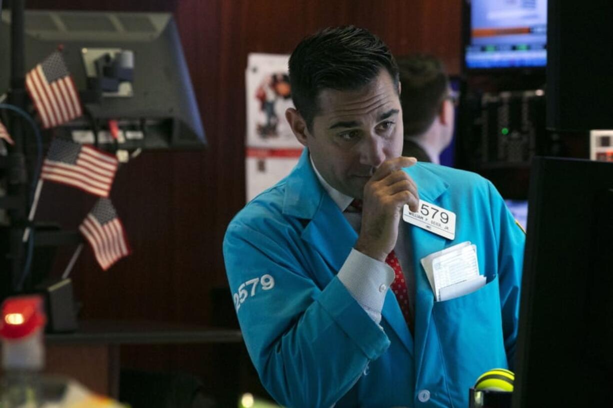 FILE - In this Oct. 2, 2019, file photo specialist William Geier works on the floor of the New York Stock Exchange. The U.S. stock market opens at 9:30 a.m. EDT on Friday, Oct. 18.