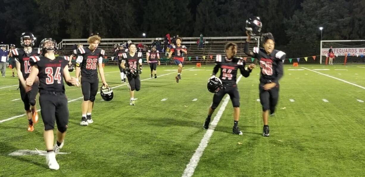 Fort Vancouver celebrates its first win, 32-22 over Northwest Christian (Lacey), in the past 31 games on Friday at Kiggins Bowl.