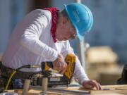 FILE- In this Aug. 27, 2018 file photo, former President Jimmy Carter works with other volunteers on site during the first day of the weeklong Jimmy &amp; Rosalynn Carter Work Project, their 35th work project with Habitat for Humanity, in Mishawaka, Ind. Carter turns 95 on Tuesday, Oct. 1, 2019.