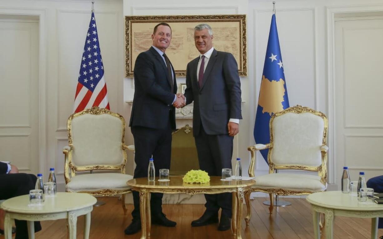 Kosovo&#039;s president Hashim Thaci, right, shakes hands with President Donald Trump&#039;s envoy for the Kosovo-Serbia dialogue, Ambassador Richard Grenell in Kosovo capital Pristina on Wednesday, Oct. 9, 2019.