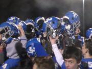 The La Center Wildcats celebrate their 28-14 win over Columbia-White Salmon (Tim Martinez/The Columbian)