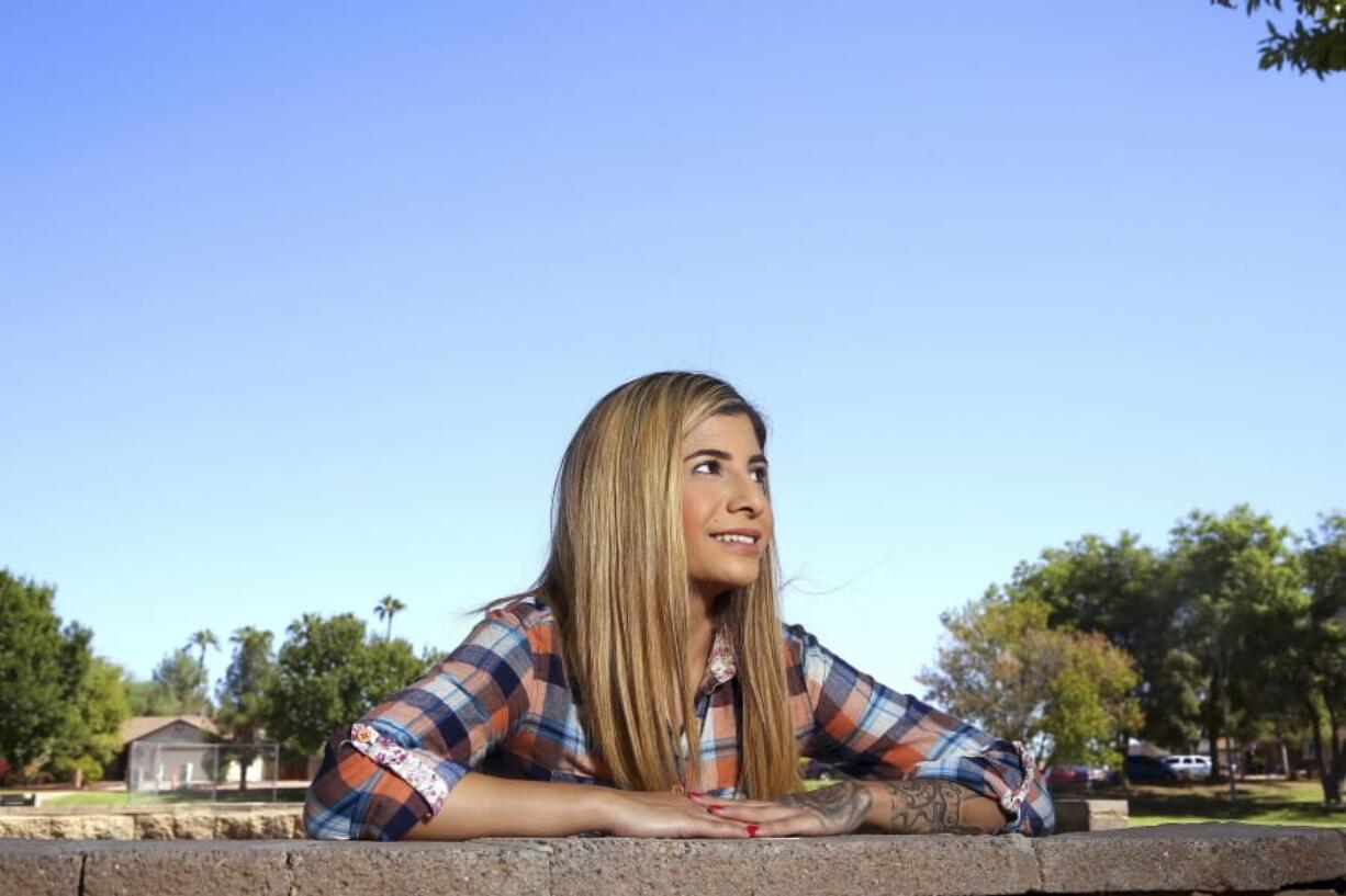 In this Tuesday, Oct. 15, 2019 photo, college student, Sheida Assar, poses for a photo in Chandler, Ariz. Assar said she was expelled from GateWay Community College in Phoenix last month for violating the school&#039;s drug policy after she tested positive for marijuana, which she uses to treat chronic pain from polycystic ovary syndrome. (AP Photo/Ross D.