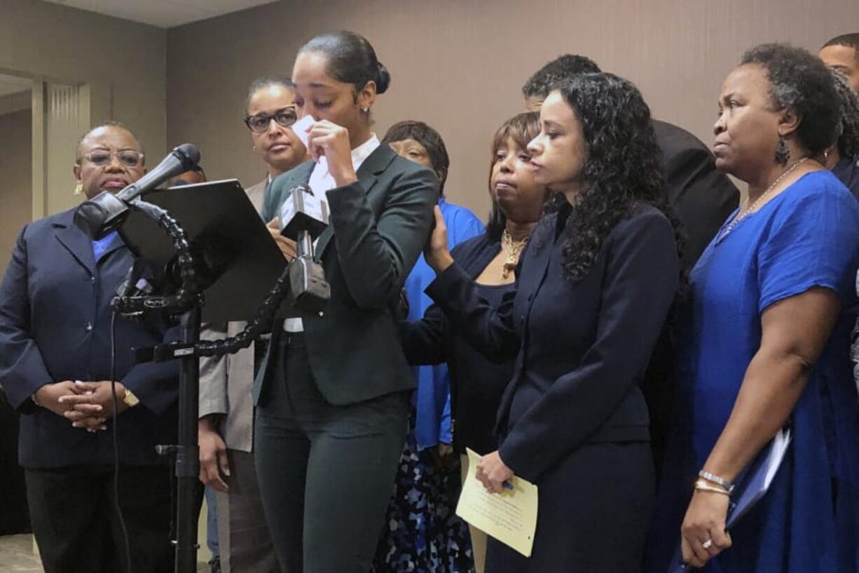 Jazmyne Childs cries during a news conference on Wednesday, Sept. 25, 2019, as she describes the sexual harassment she says she endured while employed by the North Carolina chapter of the NAACP, in Raleigh, N.C. She is asking the national NAACP to expel the man whom she identified as the person who assaulted and harassed her.