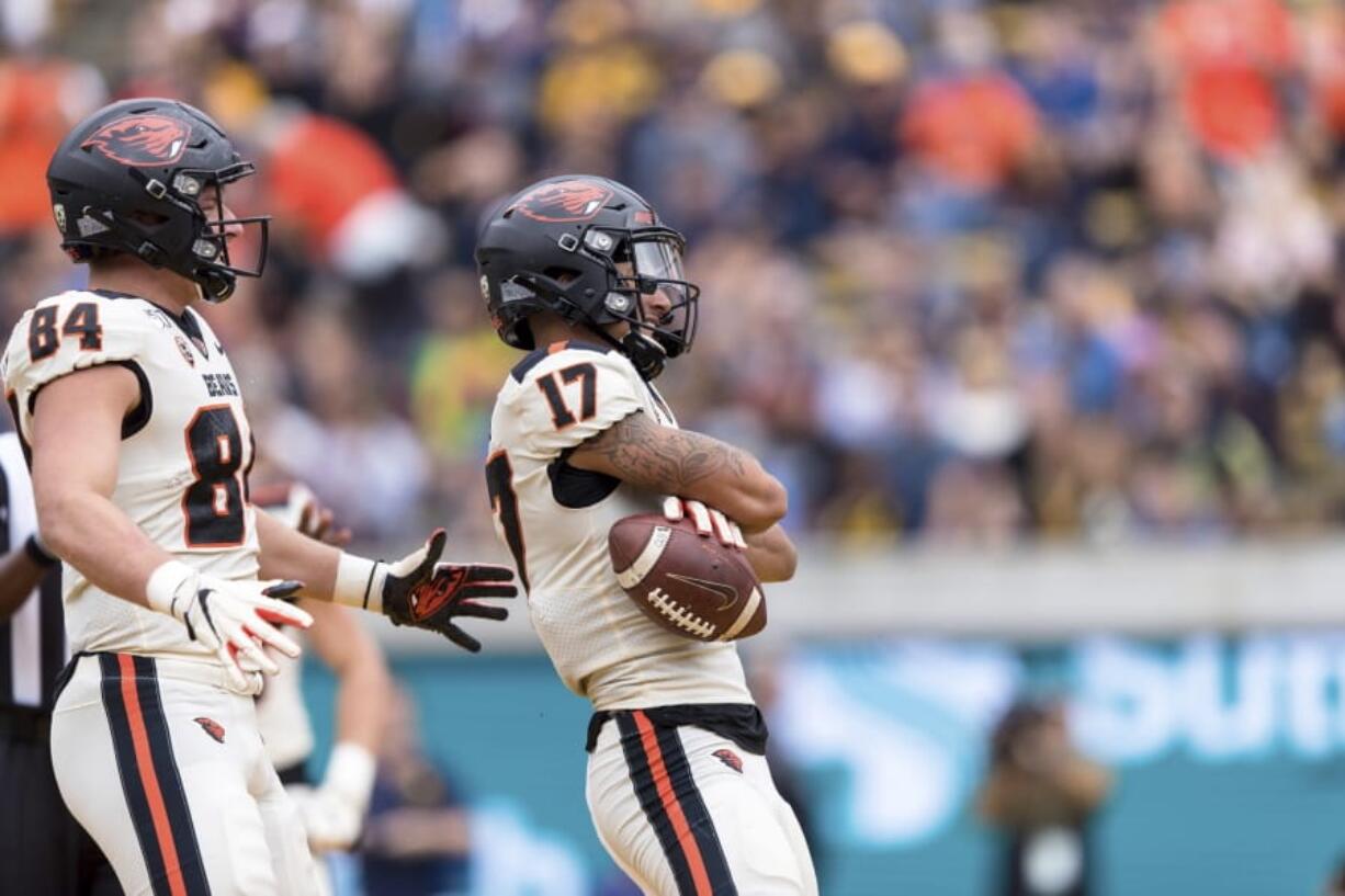 Oregon State wide receiver Isaiah Hodgins (17) reacts with tight end Teagan Quitoriano (84) after scoring a touchdown against the California  in the second quarter of an NCAA college football game in Berkeley, Calif., Saturday, October 19, 2019.