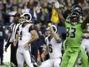 Los Angeles Rams&#039; Greg Zuerlein (4) and Seattle Seahawks free safety Tedric Thompson (33) react after Zuerlein missed a field goal in the final seconds of an NFL football game Thursday, Oct. 3, 2019, in Seattle. The Seahawks won 30-29.