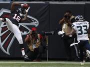 tlanta Falcons wide receiver Calvin Ridley (18) makes the catch for a two-point conversion against Seattle Seahawks free safety Tedric Thompson (33) during the second half of an NFL football game, Sunday, Oct. 27, 2019, in Atlanta.