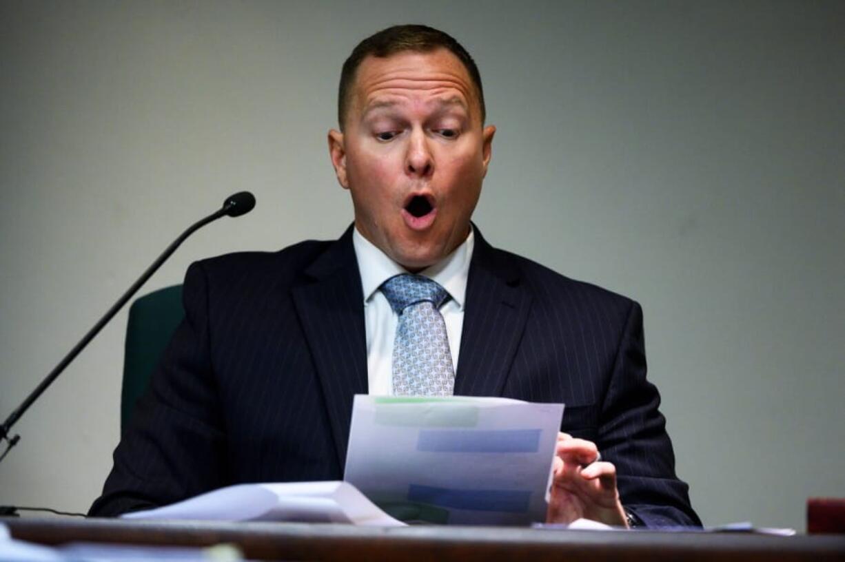 Suspended Greenville Sheriff Will Lewis reads text messages in court, Thursday afternoon, Oct. 24, 2019, in Greenville, S.C.