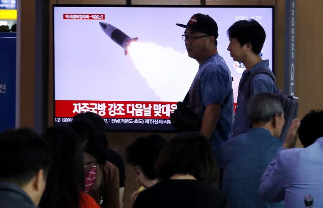 People pass by a TV showing a file image of North Korea&#039;s missile launch during a news program at the Seoul Railway Station in Seoul, South Korea, Wednesday, Oct. 2, 2019. North Korea on Wednesday fired projectiles toward its eastern sea, South Korea&#039;s military said, in an apparent display of its expanding military capabilities ahead of planned nuclear negotiations with the United States this weekend.