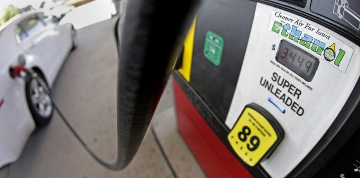 A motorist fills up with gasoline containing ethanol on July 26, 2013, in Des Moines. The Trump administration says it plans to implement new rules that will increase demand for ethanol, reversing a decline caused by exemptions given to oil refineries.