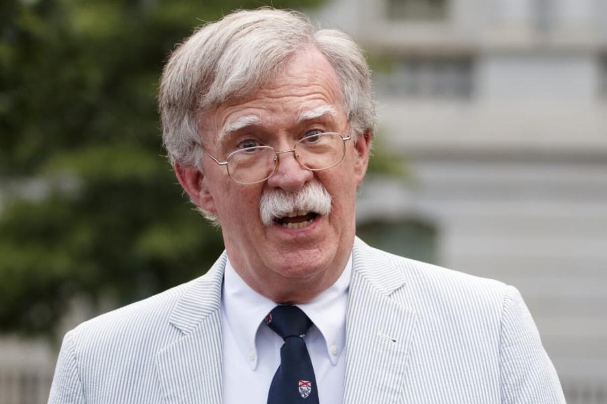 FILE - In this July 31, 2019 file photo, National security adviser John Bolton speaks to media at the White House in Washington.