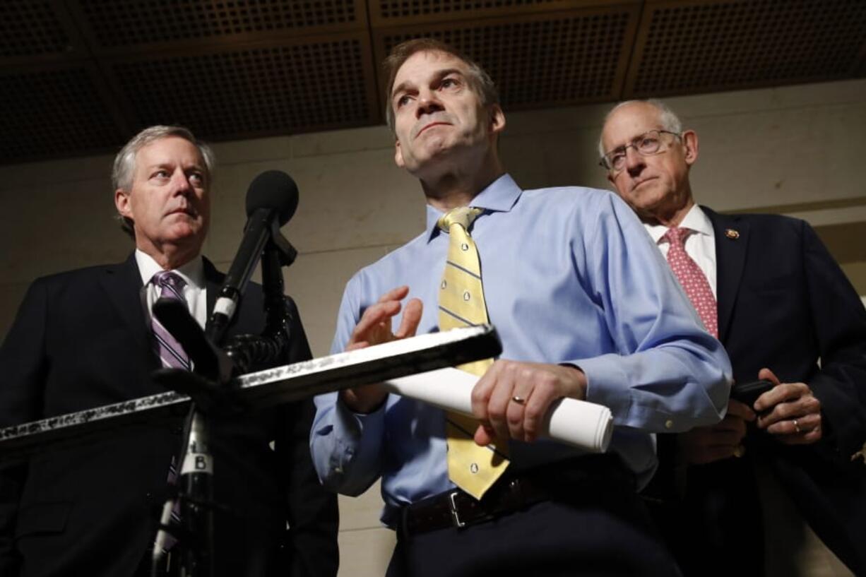 Rep. Jim Jordan, R-Ohio, center, speaks with members of the media after former deputy national security adviser Charles Kupperman signaled that he would not appear as scheduled for a closed door meeting to testify as part of the House impeachment inquiry into President Donald Trump, Monday, Oct. 28, 2019, on Capitol Hill in Washington. Standing with Jordan are Rep. Mark Meadows, R-N.C., left, and Rep. Michael Conaway, R-Texas.