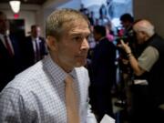 Republican lawmakers, from left, Rep. Scott Perry, R-Pa., Rep. Lee Zeldin R-N.Y., and Rep. Jim Jordan, R-Ohio, ranking member of the Committee on Oversight Reform, walk into a meeting after speaking to reporters where former White House advisor on Russia, Fiona Hill, will testify before congressional lawmakers as part of the House impeachment inquiry into President Donald Trump, on Capitol Hill in Washington, Monday, Oct. 14, 2019.