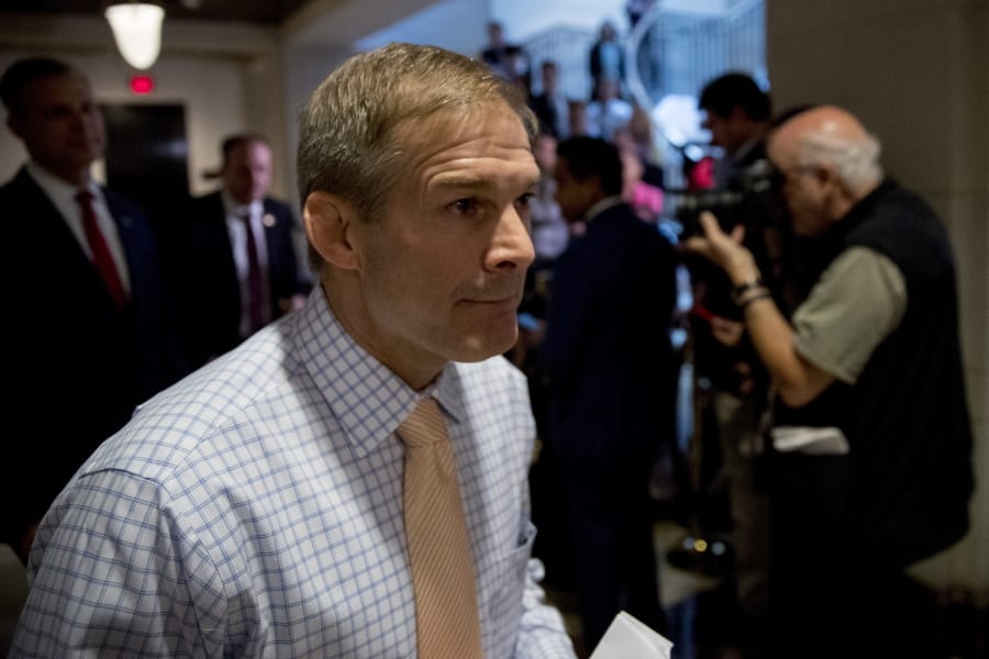 Republican lawmakers, from left, Rep. Scott Perry, R-Pa., Rep. Lee Zeldin R-N.Y., and Rep. Jim Jordan, R-Ohio, ranking member of the Committee on Oversight Reform, walk into a meeting after speaking to reporters where former White House advisor on Russia, Fiona Hill, will testify before congressional lawmakers as part of the House impeachment inquiry into President Donald Trump, on Capitol Hill in Washington, Monday, Oct. 14, 2019.