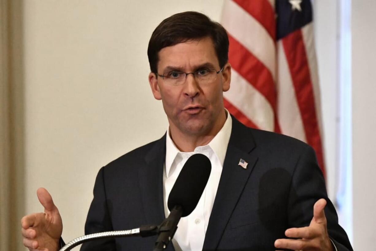 FILE - In this Friday, Oct. 4, 2019 file photo, Defense Secretary Mark Esper speaks to a gathering of soldiers at the University Club at the University of Louisville in Louisville, Ky. Esper says during a weekend trip to the Middle East that under the current plan all U.S. troops leaving Syria will go to western Iraq, and that the military will continue to conduct operations against the Islamic State group to prevent a resurgence in that country. As Esper left Washington on Saturday, Oct. 19, U.S. troops were continuing to pull out of northern Syria after Turkey&#039;s invasion into the border region. (AP Photo/Timothy D.