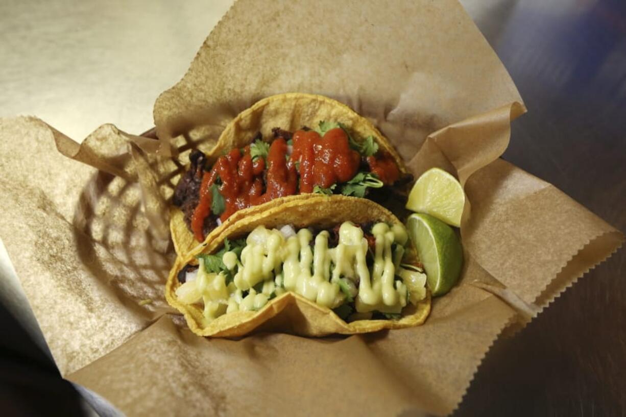 Fresh tacos served up at the Mi Vegana Madre restaurant offering Mexican vegan food in Glendale, Ariz. No longer just a few items on a mainstream restaurant&#039;s menu, vegan Mexican food has become a widening industry on its own with Latinos taking control of the kitchen. (AP Photo/Ross D. Franklin) (Ross D.