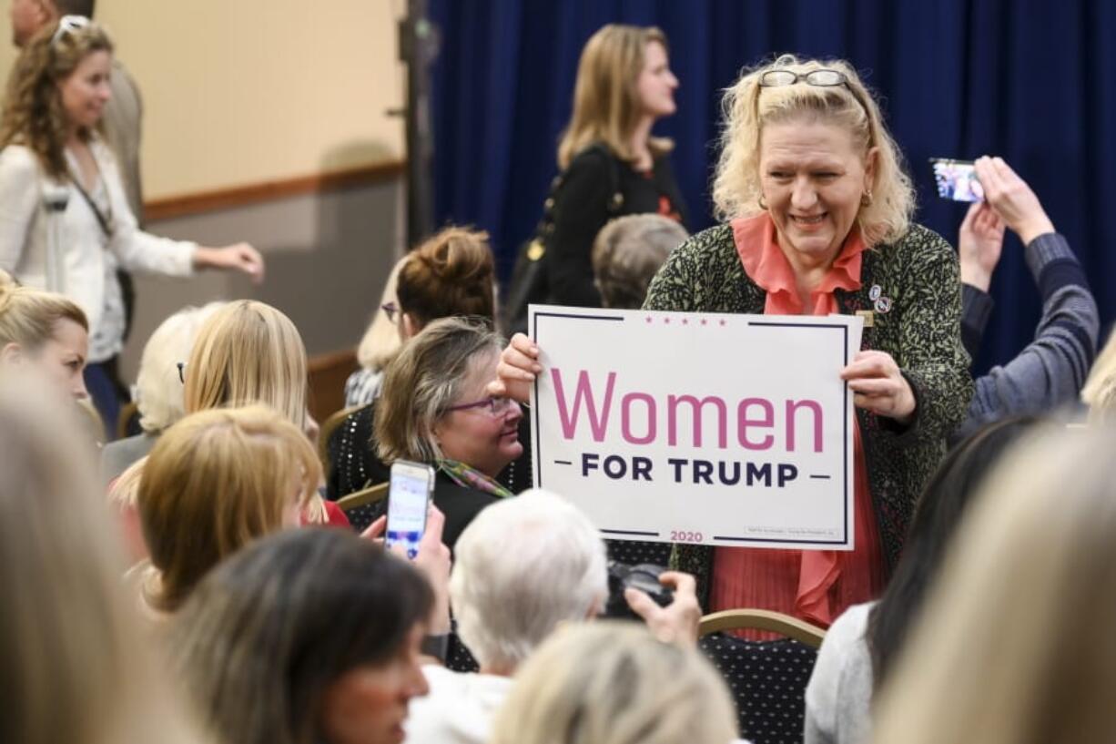 A Trump supporter posed with her sign before the start of a  &quot;Women for Trump&quot; event at the Union Depot, in St. Paul. Minn., Wednesday, Oct. 9, 2019.