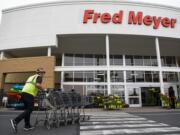 Fred Meyer grocery stores, including the seven in Clark County, on Wednesday began charging customers for getting cash back from its checkout stands.