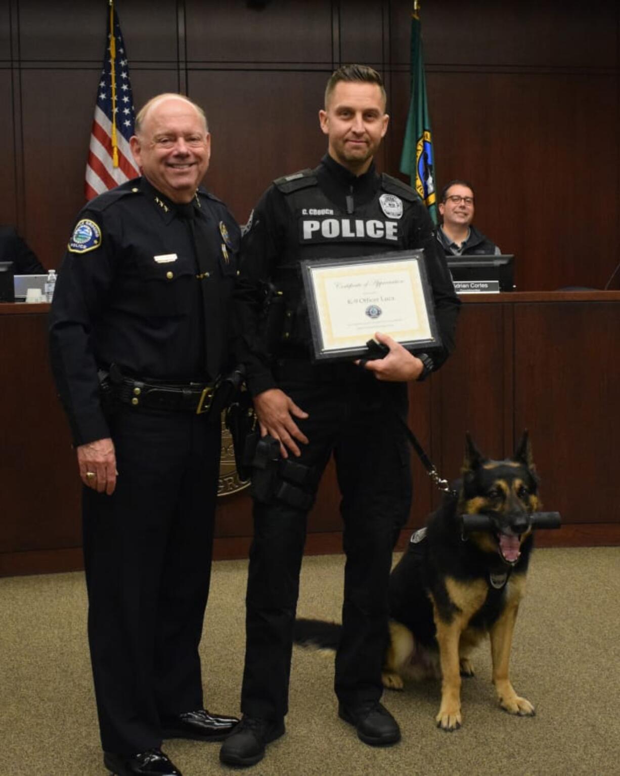 Battle Ground police dog Luca and his handler, Sgt. Chris Crouch, were honored Monday during a Battle Ground City Council meeting. The duo is retiring from the department after working together for six years.