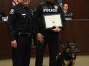 Battle Ground police dog Luca and his handler, Sgt. Chris Crouch, were honored Monday during a Battle Ground City Council meeting. The duo is retiring from the department after working together for six years.