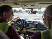 Dean Van Nostern, left, and Andy Chumbley, both of Vancouver start their Neighbors on Watch volunteer patrol from the Vancouver Police Department East Precinct. The volunteers can help spot and deter car prowls.