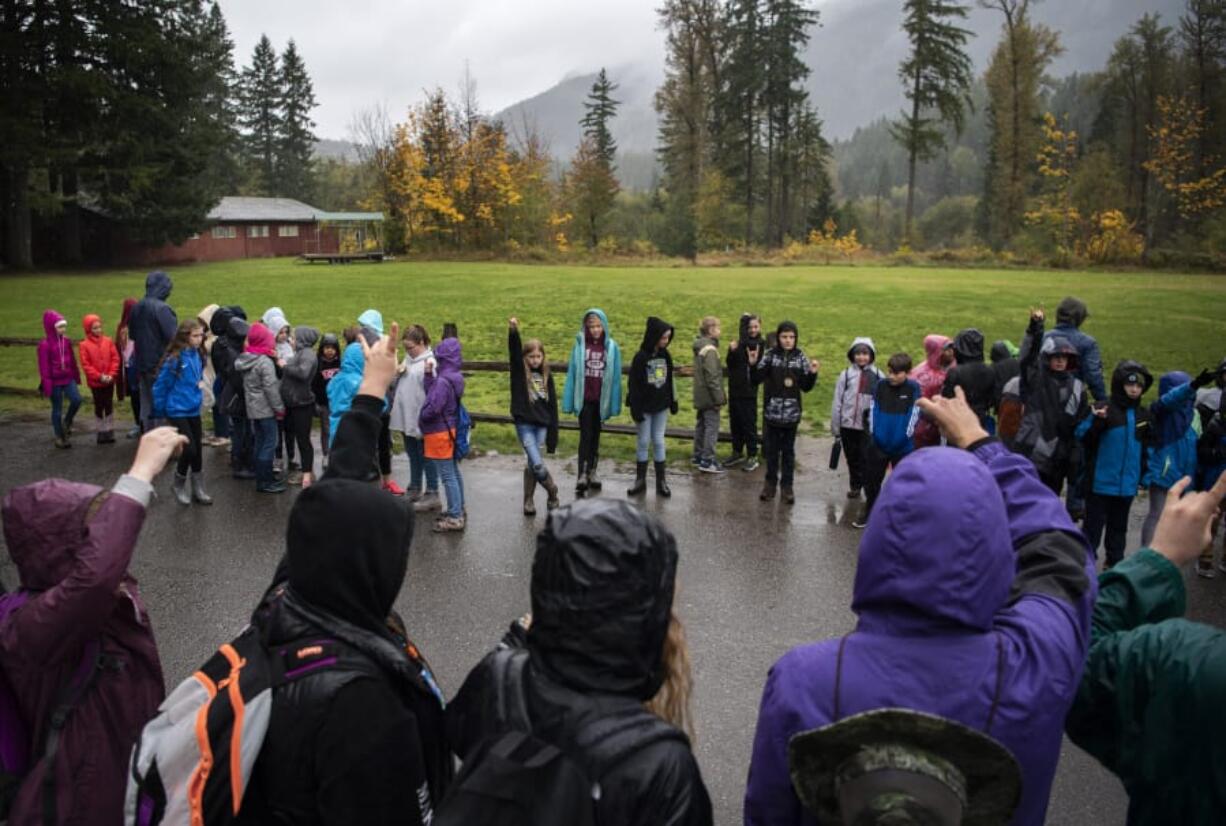 Students line up outside the cafeteria before going into lunch during the weeklong outdoor program at the Cispus Learning Center in Randle on Oct. 8.