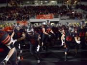 The Camas Papermakers enter Doc Harris Stadium to start the second half of a game against Union in Camas on Friday night, November 1, 2019. Camas beat Union 28-14.