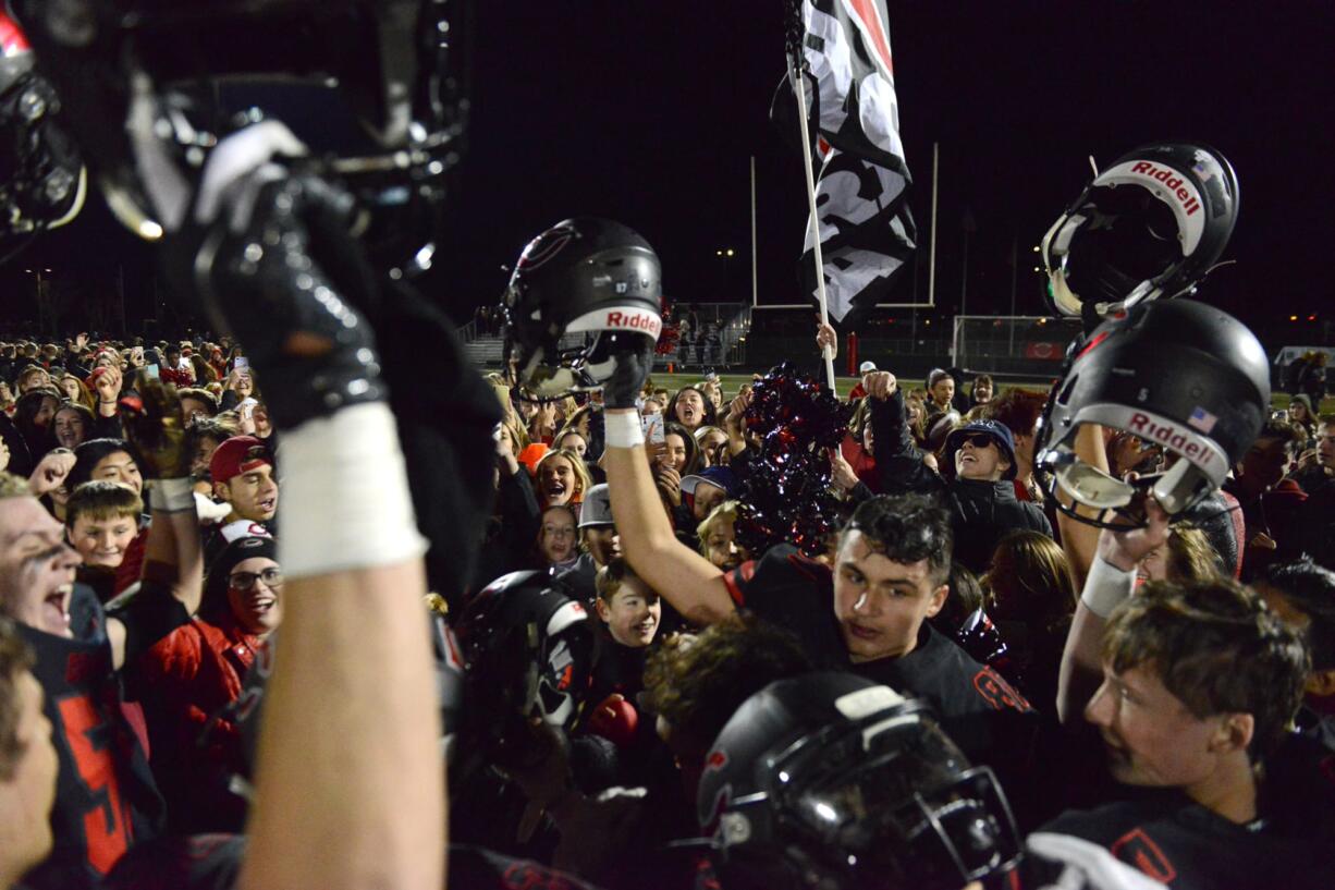 The Camas Papermakers celebrate a win against Union at Doc Harris Stadium in Camas on Friday night, November 1, 2019. Camas beat Union 28-14.