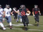 Camas running back Randy Yaacoub sprints for open field against Union at Doc Harris Stadium in Camas on Friday night, November 1, 2019. Camas beat Union 28-14.