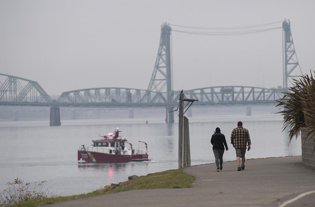 Vancouver residents Kelly and Justin Venetucci take in a foggy view of the Columbia River while enjoying a brisk, fall walk together Monday morning, Nov. 4, 2019. The couple said they try to walk together almost everyday although they wouldn't mind if blue skies made an appearance again. "I like the sunny fall," Kelly Venetucci said.