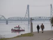 Vancouver residents Kelly and Justin Venetucci take in a foggy view of the Columbia River while enjoying a brisk, fall walk together Monday morning, Nov. 4, 2019. The couple said they try to walk together almost everyday although they wouldn't mind if blue skies made an appearance again. "I like the sunny fall," Kelly Venetucci said.