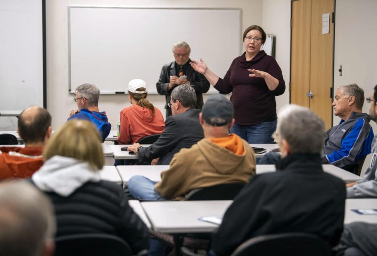 Camas Mayor Shannon Turk speaks to a packed crowd at a Camas ward meeting at the Camas-Washougal Fire Department Station 42 Thursday night. It was the first chance residents had to speak to a bulk of the city council since residents resoundingly defeated a $78 bond measure in Tuesday&#039;s election.