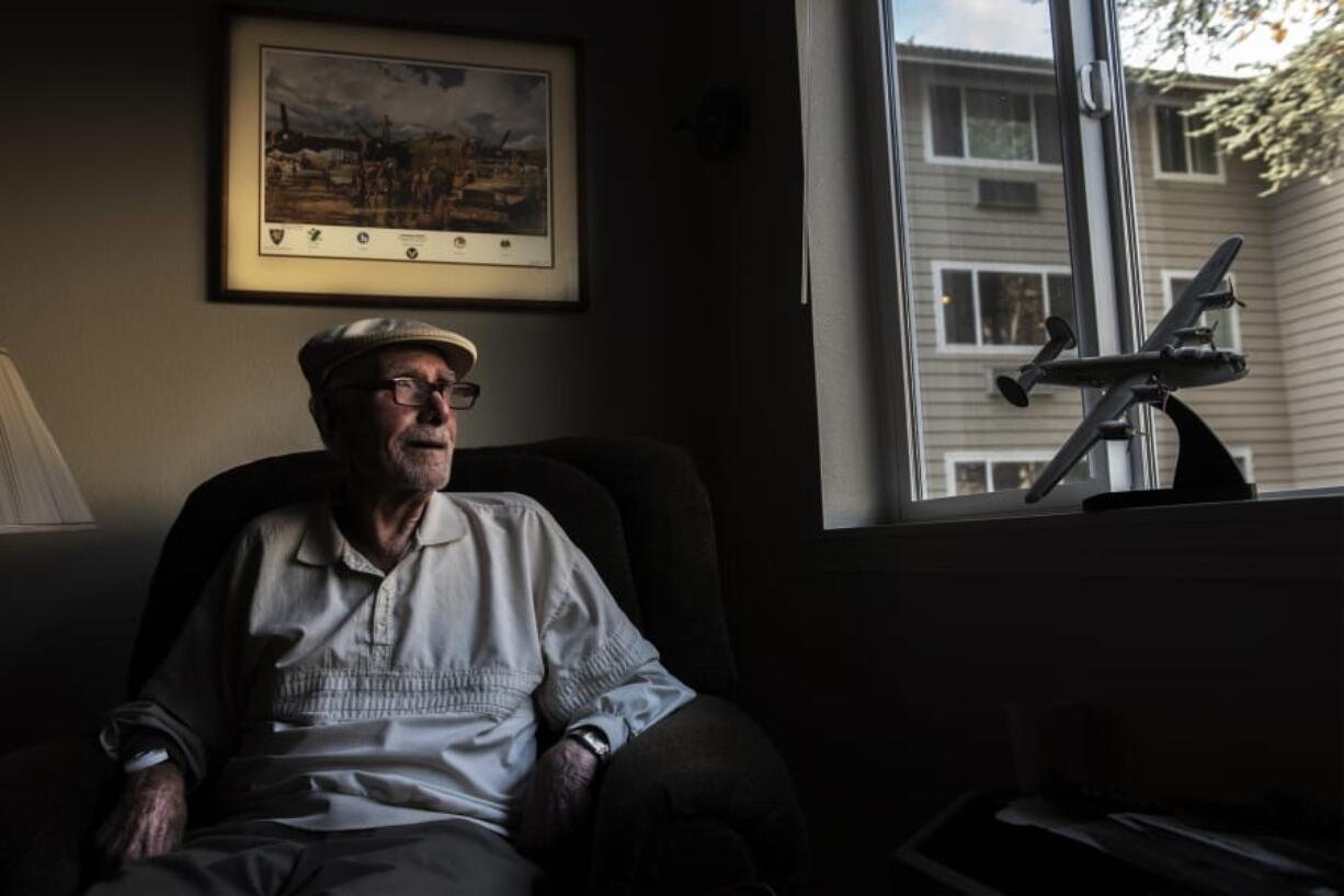 Harold McCarty, who flew 50 combat missions on a B-24 Liberator 75 years ago during World War II, has a model and print of the heavy bomber in his apartment at the Van Mall Retirement Community. Below, McCarty earned these decorations for his wartime service.