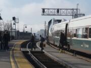 Passengers make their way off an Amtrak Cascade train after arriving in Vancouver.