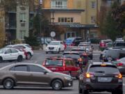 Traffic backs up on West 14th Street as voters drop off ballots in downtown Vancouver on Election Day.