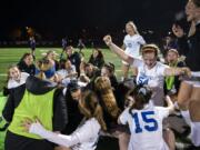 Ridgefield players celebrate their win over Columbia River.