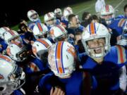 The Ridgefield Spudders celebrate a win against Aberdeen at Ridgefield High School on Saturday night, November 9, 2019. Ridgefield routed Aberdeen 49-6 to move to the state tournament.