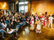 Members of the Vancouver Ballet Folklorico perform during a Día de los Muertos celebration Sunday at the Vancouver Community Library.