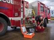 Clark County Fire &amp; Rescue Chief John Nohr describes the emergency medical equipment stored on the fire engines at Fire Station 21 in Ridgefield.