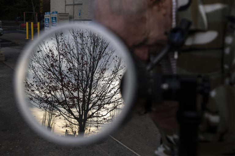 Stan Seeberg with The Vancouver Sidewalk Astronomers watches the transit of Mercury in front of the Sun while in the parking lot of the Hazel Dell Safeway on Monday morning, Nov. 11, 2019.