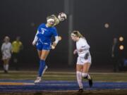 Ridgefield&#039;s Annika Farley (3) heads the ball during round one of the 2A state playoffs on Tuesday in Ridgefield on Nov. 12, 2019. Ridgefield defeated Sequim 3-0.