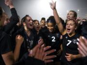 Union players celebrate their win after round one of the 4A state soccer playoffs at McKenzie Stadium in Vancouver on Wednesday, Nov. 13, 2019. After overtime and a penalty kick shootout, Union secured the win over Lake Stevens 4-3.