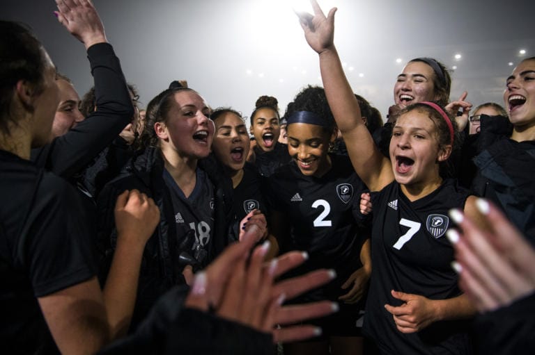 Union players celebrate their win after round one of the 4A state soccer playoffs at McKenzie Stadium in Vancouver on Wednesday, Nov. 13, 2019. After overtime and a penalty kick shootout, Union secured the win over Lake Stevens 4-3.