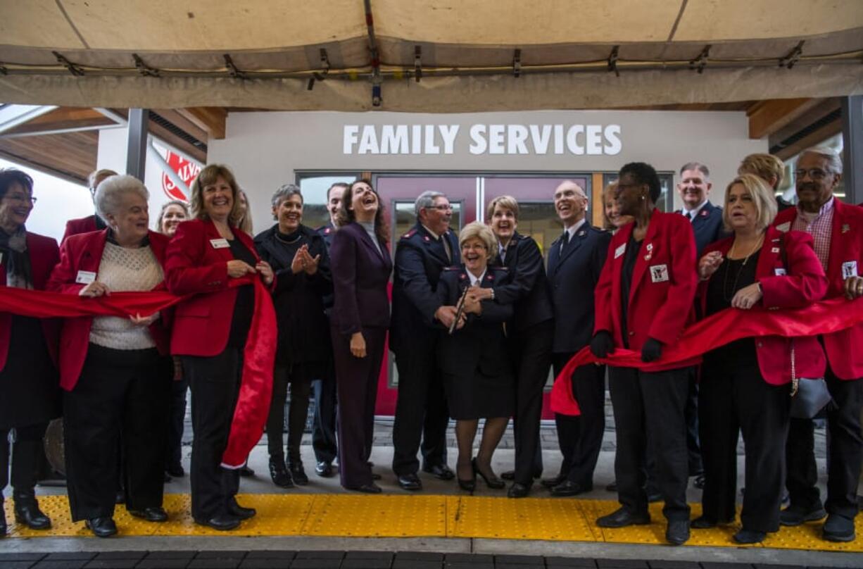 Local officials and Salvation Army leaders cut the ribbon during the Nov. 15 grand opening for the newly expanded Salvation Army campus in east Vancouver.