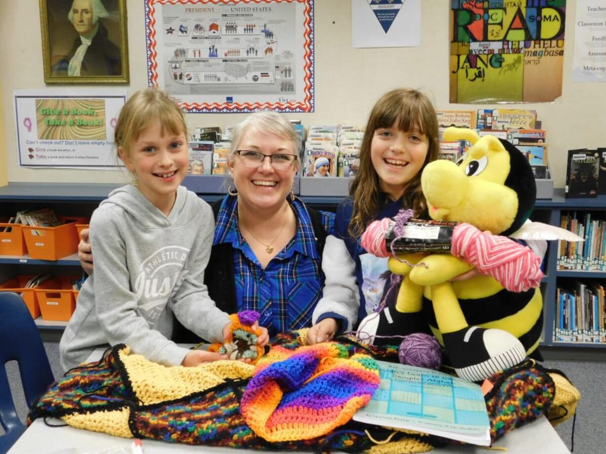 Ridgefield: South Ridge Elementary School librarian Emily Crawford, and third-graders Marta Krawczyk, left, and Liberty Glessing show their Crochet Club projects.