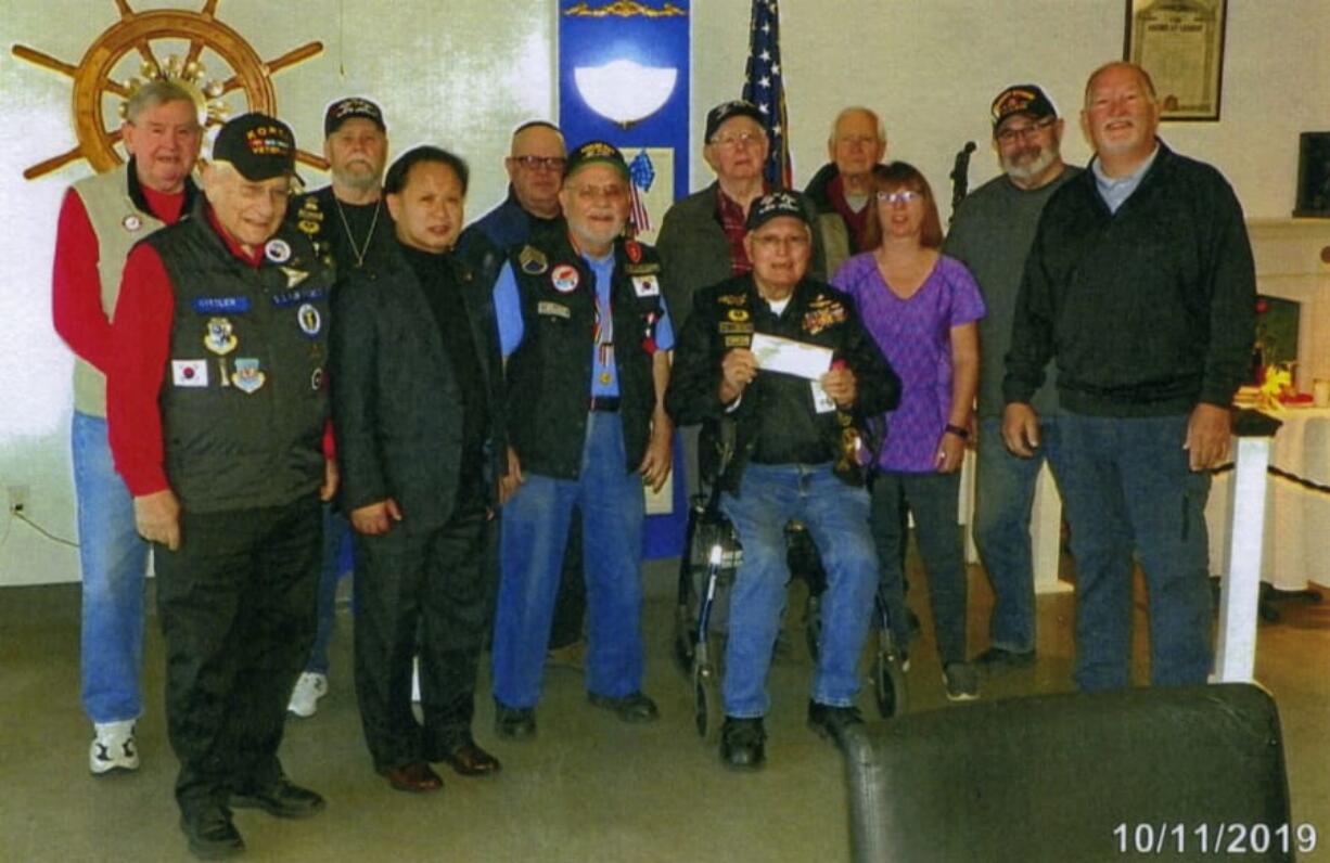 Esther Short: Members of the Labor Roundtable of Southwest Washington present a check to the Clark County chapter of the National Korean War Veterans Association Inc., the Richard L.