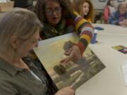 Amboy Art Club member and Cowlitz County resident Denise Cousineau, left, gets feedback Saturday on her painting from Dawn Swatosh, who acts as the club&#039;s facilitator. The group&#039;s monthly meetings consist of a loosely led discussion, with most of the time devoted to sharing and critiquing each other&#039;s work.