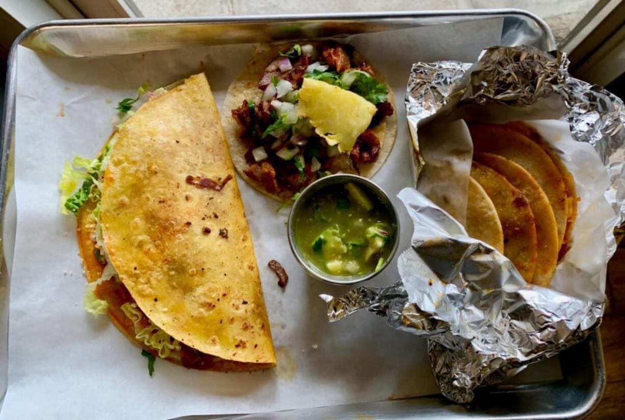 A keka, taco al pastor and basket tacos at Los Alambres.