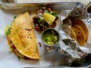 A keka, taco al pastor and basket tacos at Los Alambres.